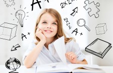 education and school concept — little student girl studying at school
